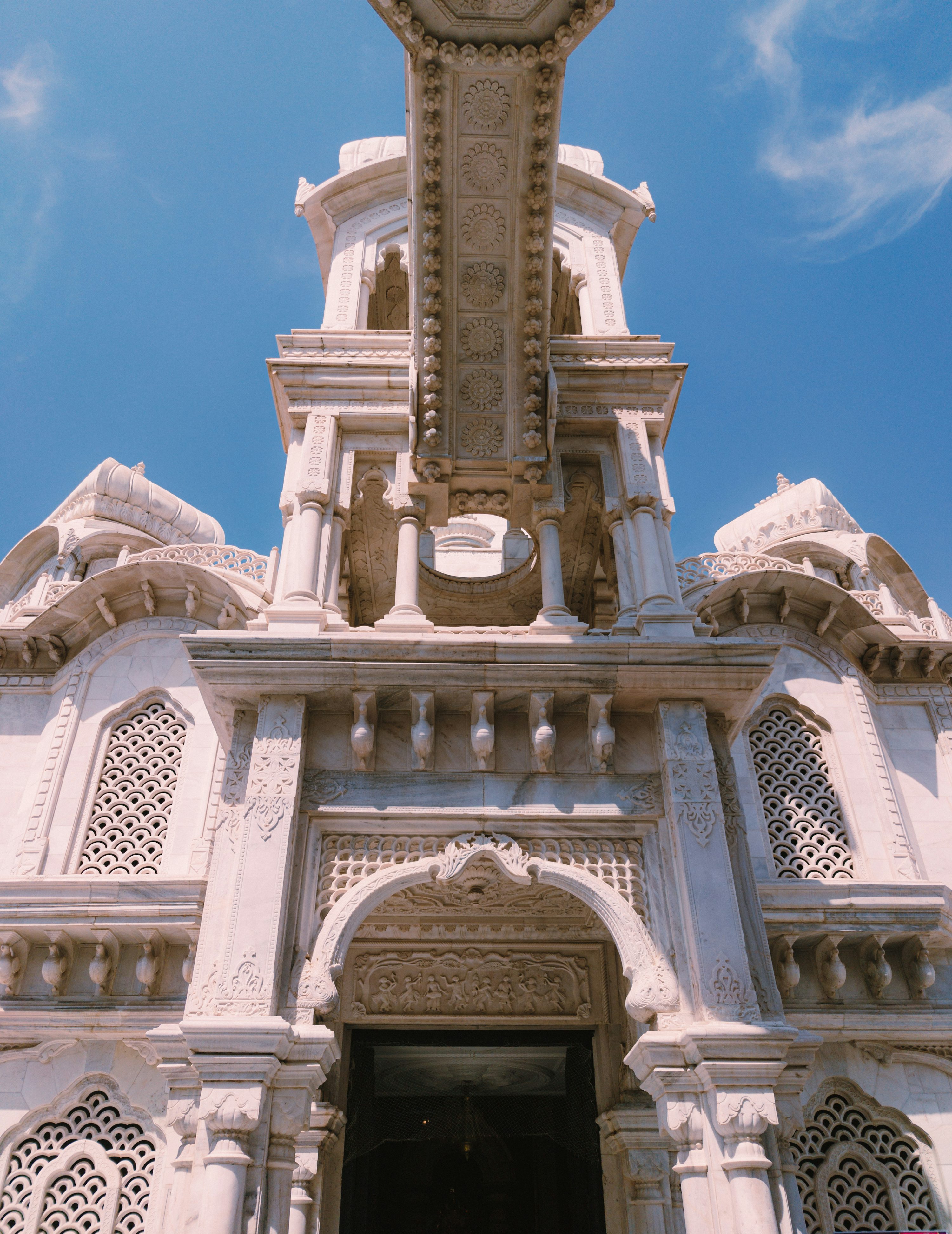 Pillared marble mandir with Om medallion and elephants